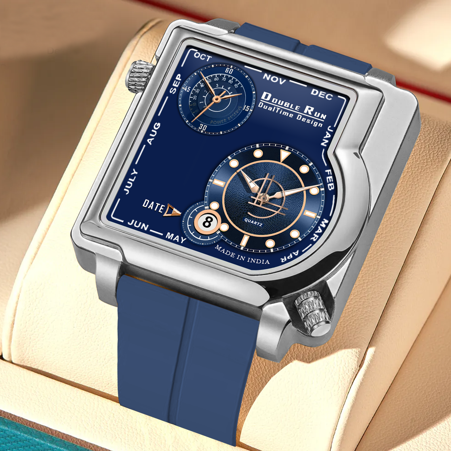 Double Run DualTime square dial blue watch with silicone strap displayed in a leather watch box.