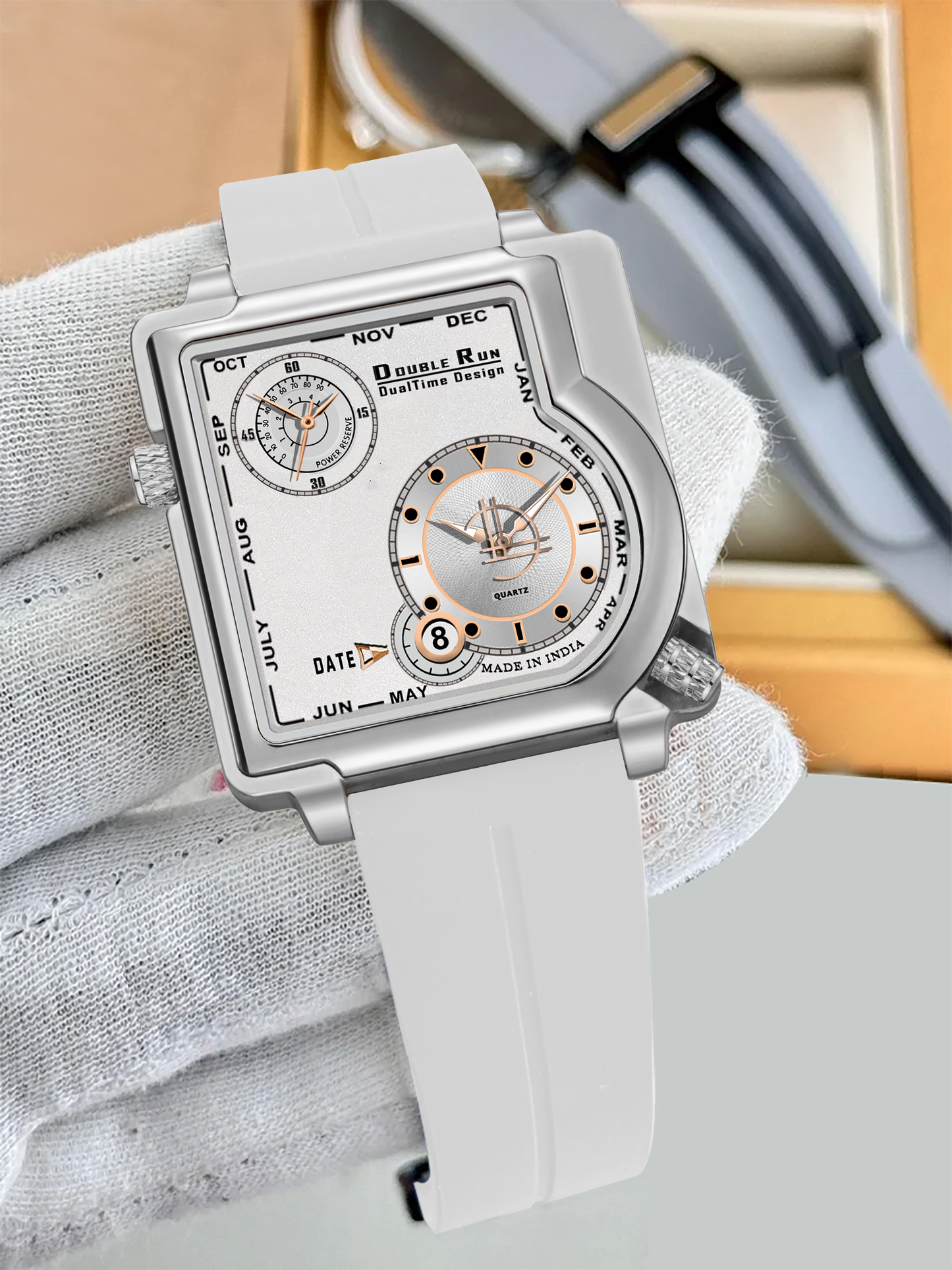 Premium Double Run DualTime square dial white strap watch for men displayed in hand with packaging box in background.